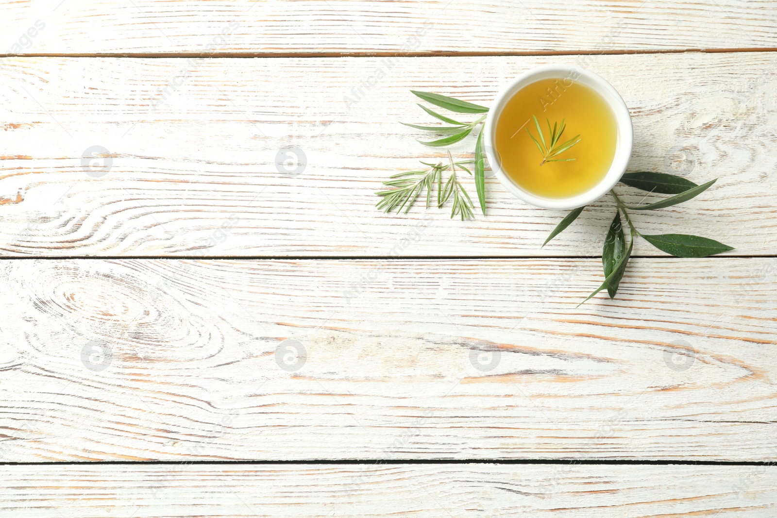 Photo of Flat lay composition with fresh olive oil on wooden background