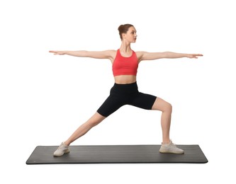 Photo of Young woman practicing yoga on white background