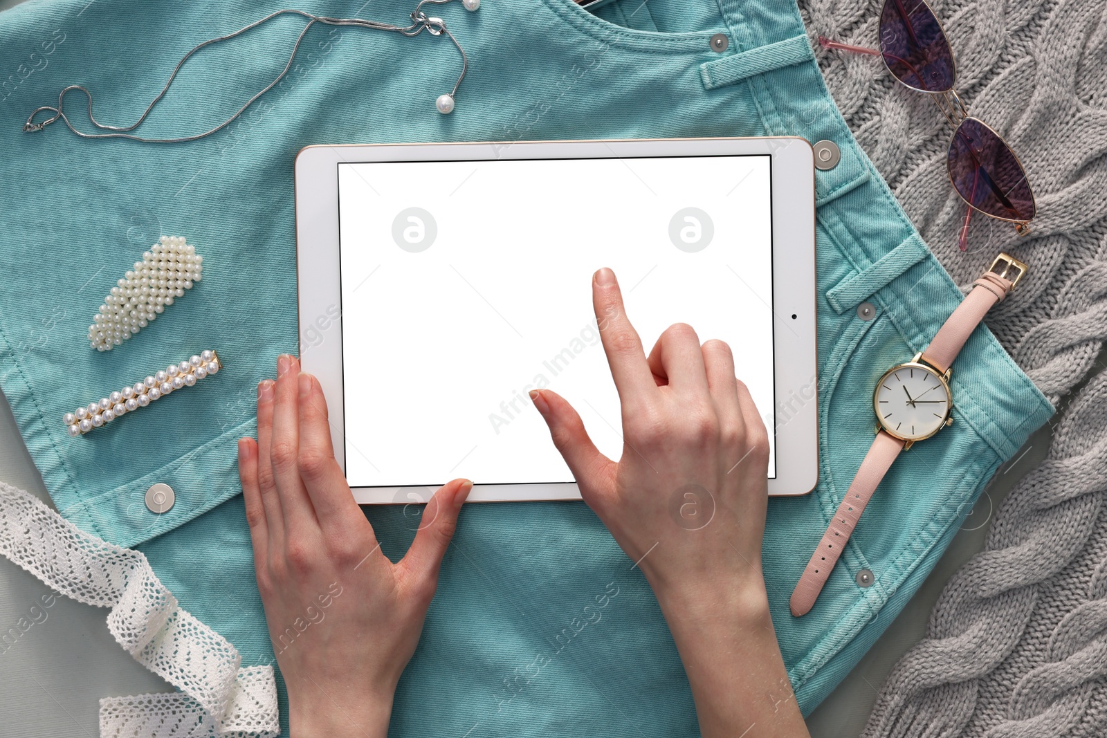 Photo of Woman with modern tablet at table, top view. Space for text