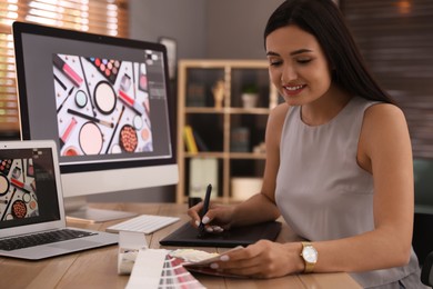 Photo of Professional retoucher working on computer in office