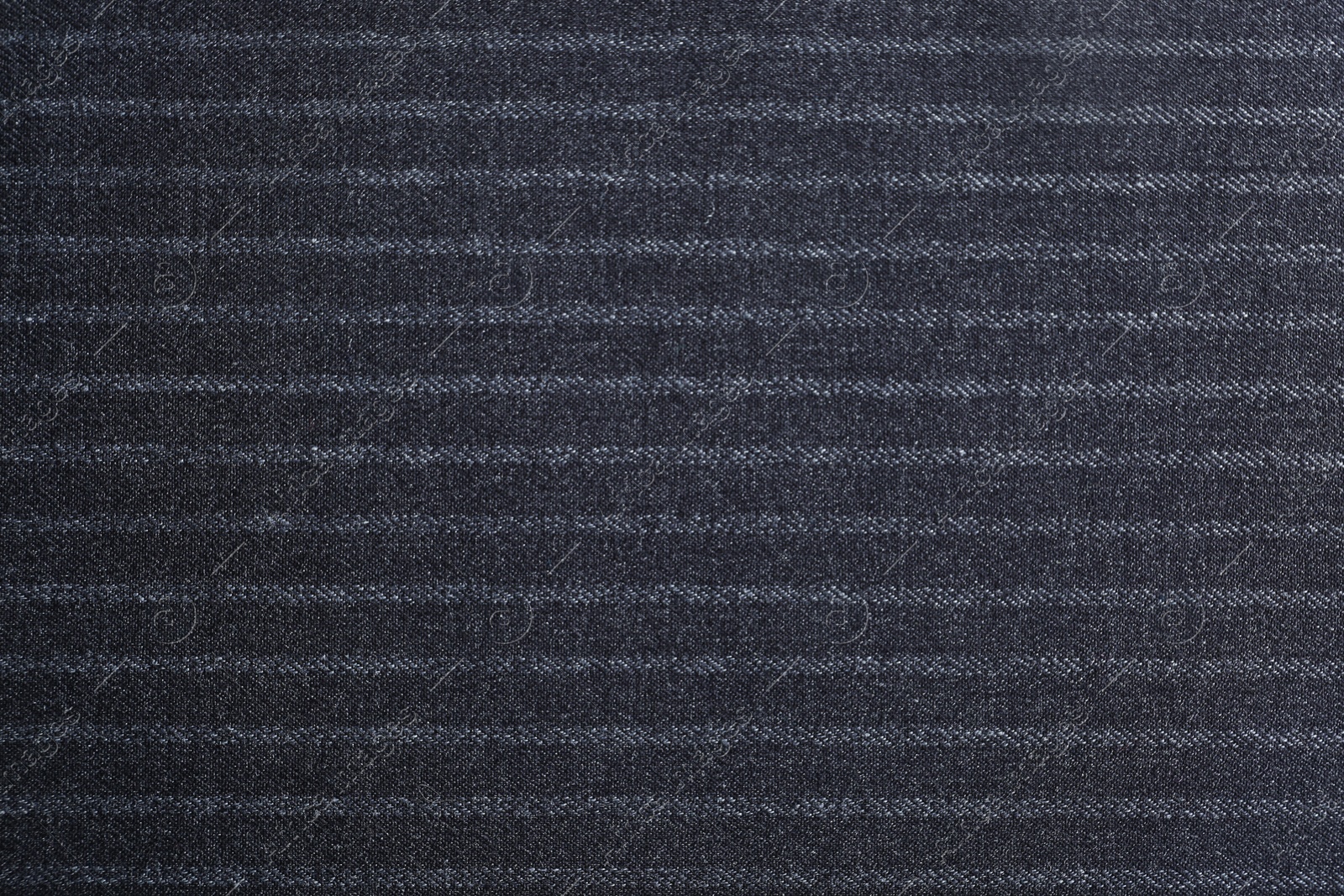 Photo of Texture of dark striped fabric as background, closeup