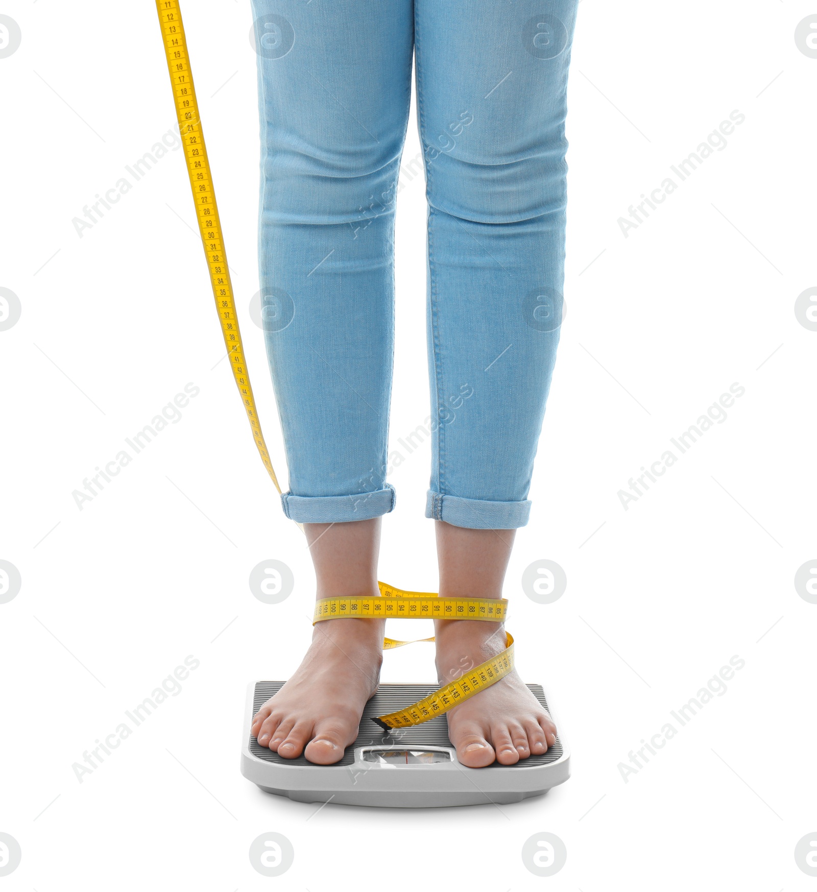 Photo of Woman with tape measuring her weight using scales on white background. Healthy diet