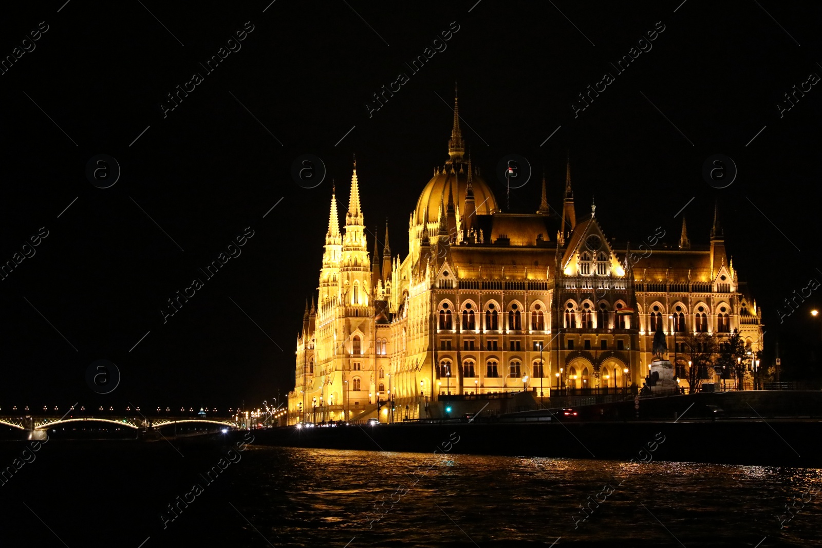 Photo of BUDAPEST, HUNGARY - APRIL 27, 2019: Beautiful night cityscape with illuminated Parliament Building and Margaret Bridge across Danube river