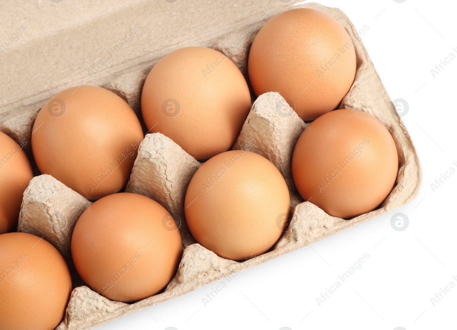 Photo of Chicken eggs in carton isolated on white, top view