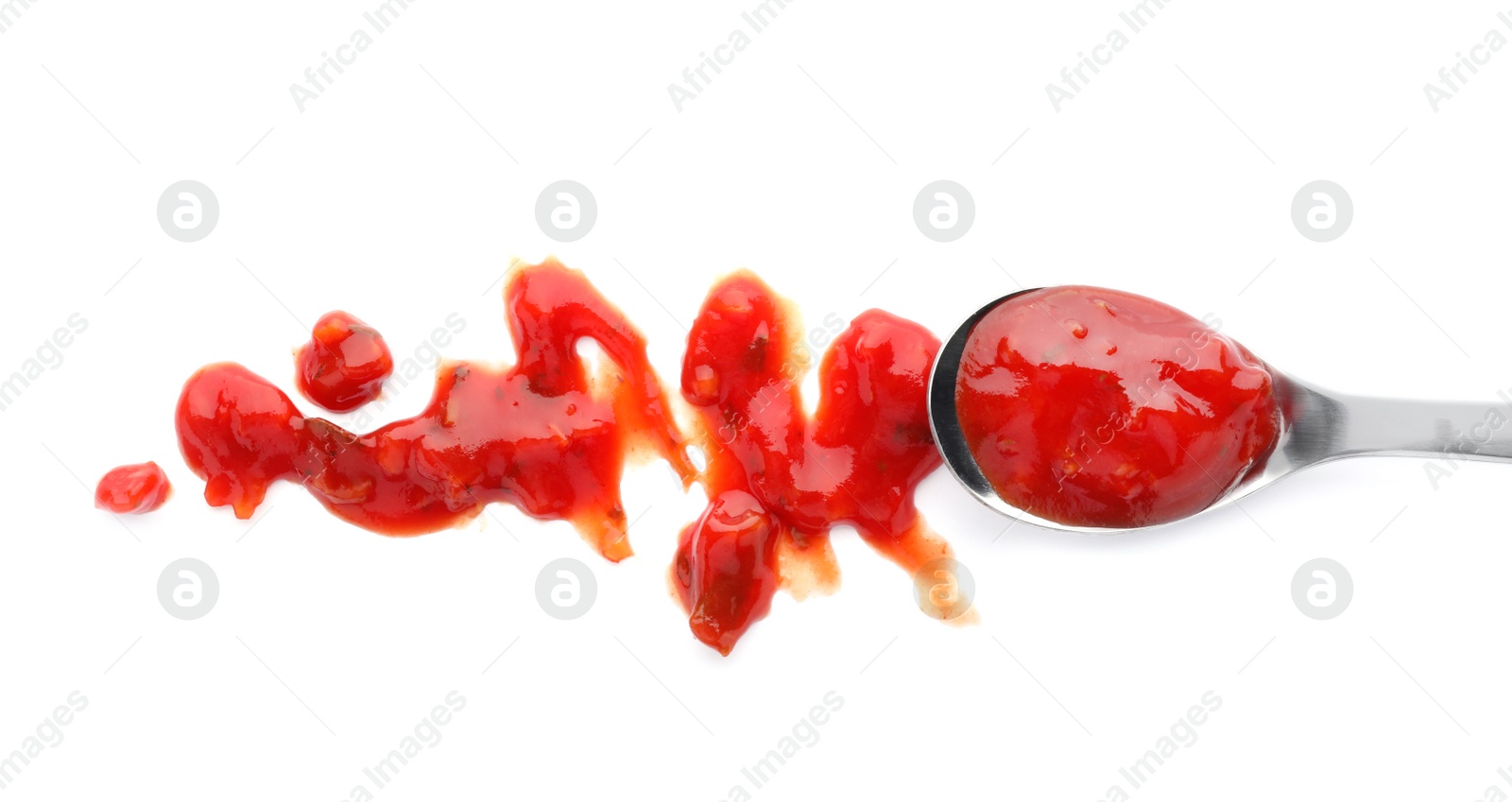 Photo of Spoon with spicy chili sauce on white background, top view