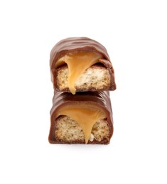 Pieces of chocolate bar with caramel on white background, closeup