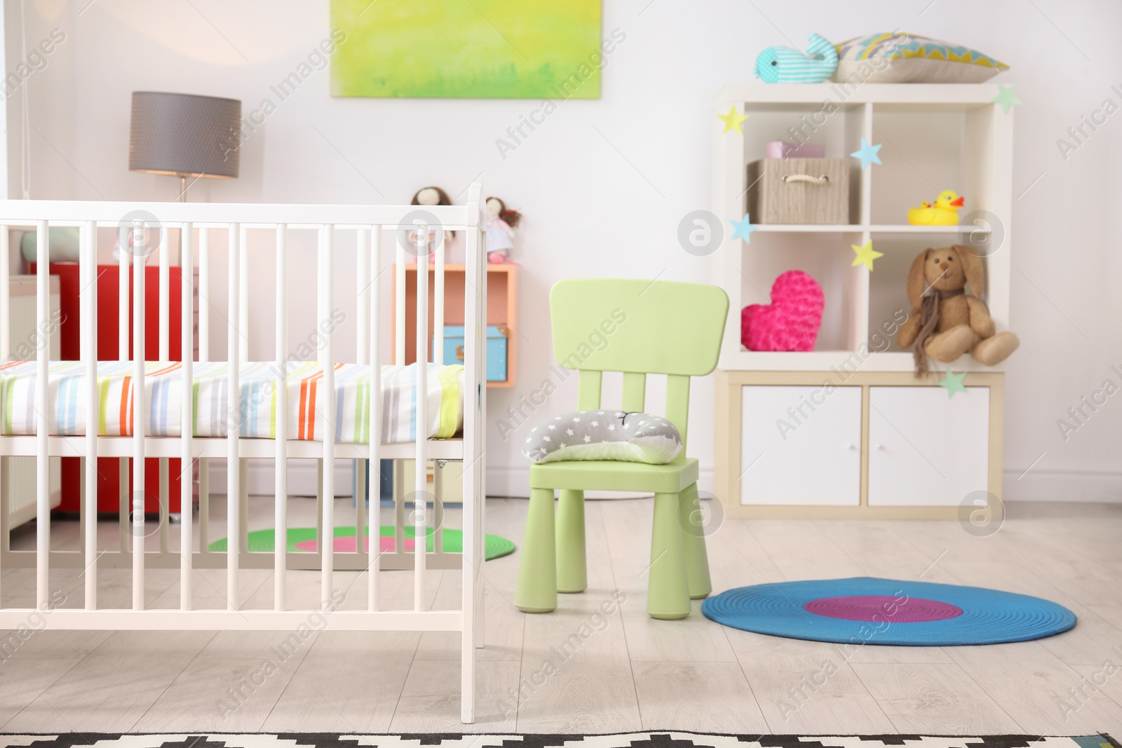 Photo of Baby room interior with comfortable crib