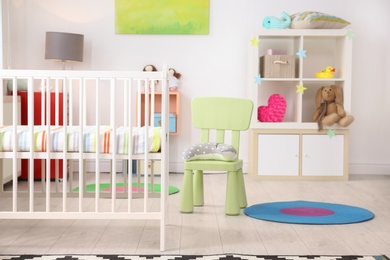 Baby room interior with comfortable crib