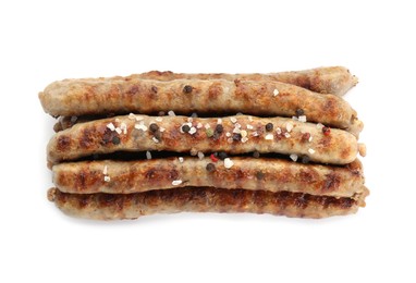 Tasty grilled sausages with spices isolated on white, top view