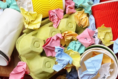 Photo of Pile of paper and cardboard garbage as background, top view. Recycling problem