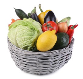 Photo of Wicker basket with fresh ripe vegetables and fruit on white background