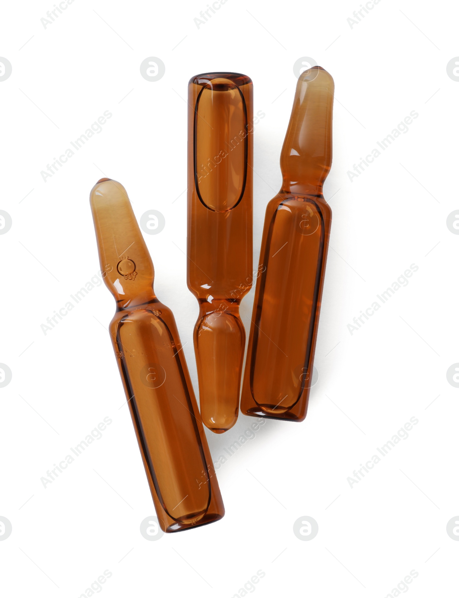 Photo of Glass ampoules with pharmaceutical product on white background, top view