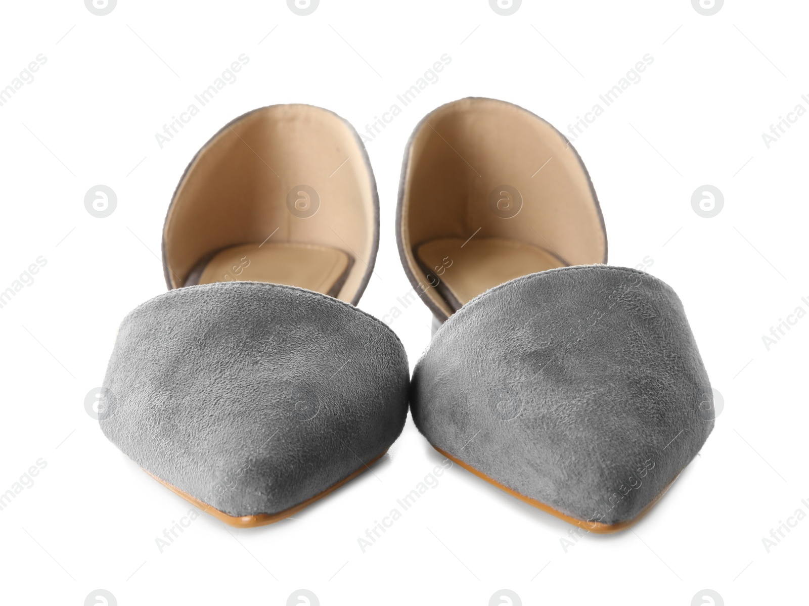 Photo of Pair of female shoes on white background