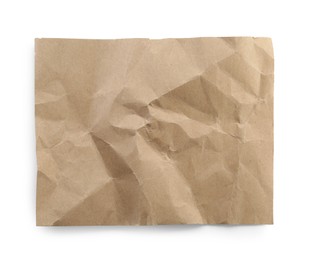 Photo of Crumpled kraft notebook sheet isolated on white, top view