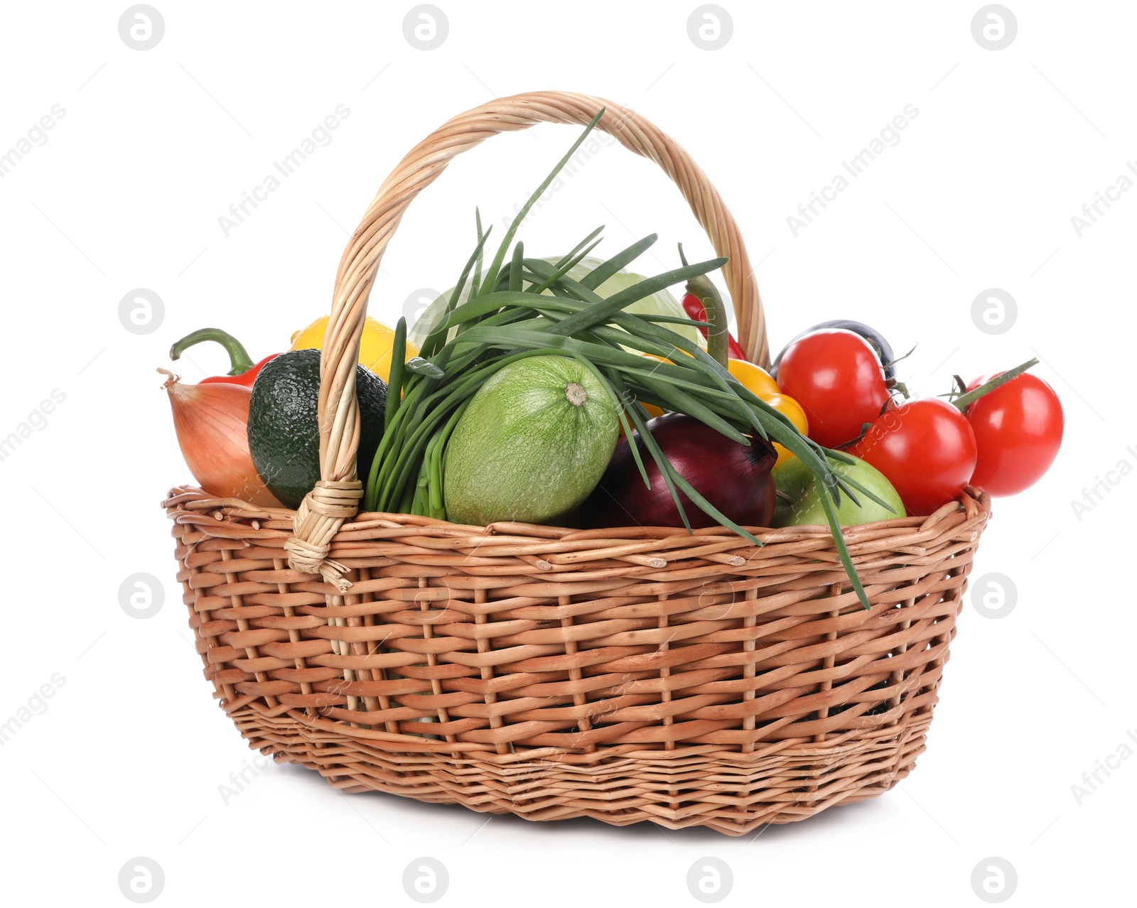 Photo of Fresh ripe vegetables and fruits in wicker basket on white background