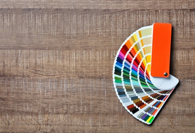 Photo of Color palette samples on wooden background