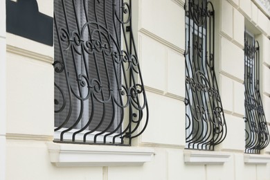 Beautiful windows with grills in building outdoors