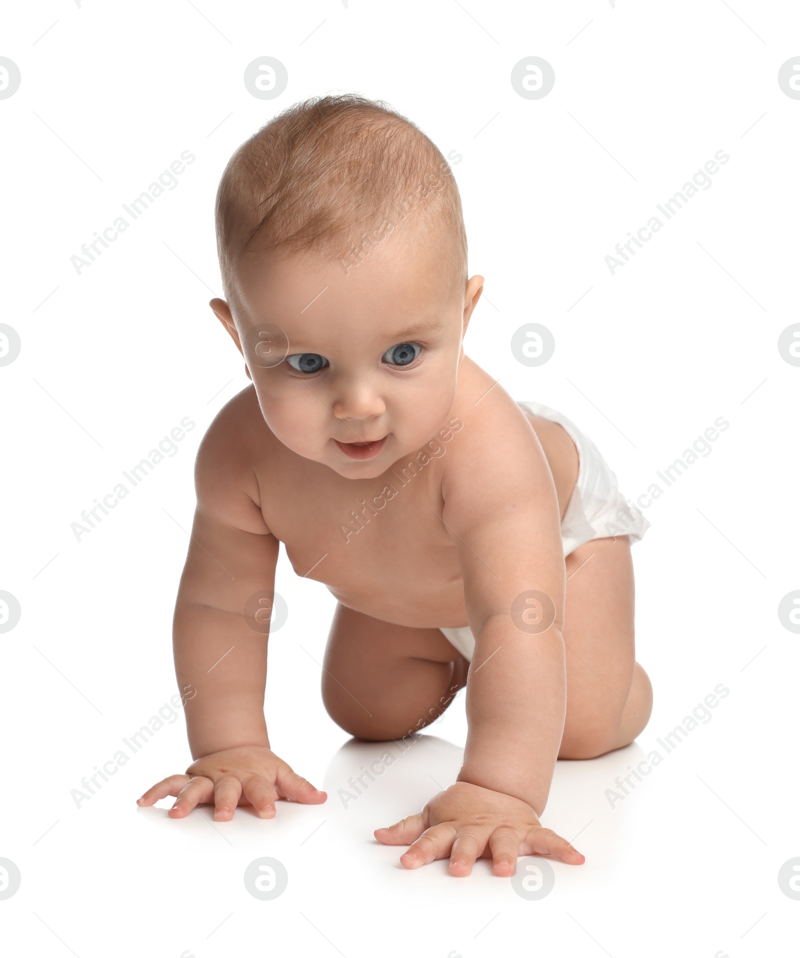 Photo of Cute little baby in diaper crawling on white background