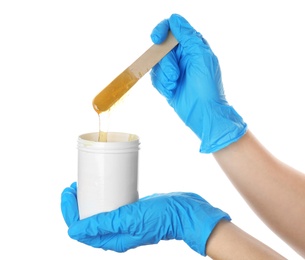 Woman with wooden stick and sugaring paste on white background, closeup