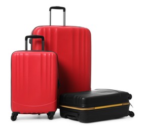 Modern suitcases for travelling on white background