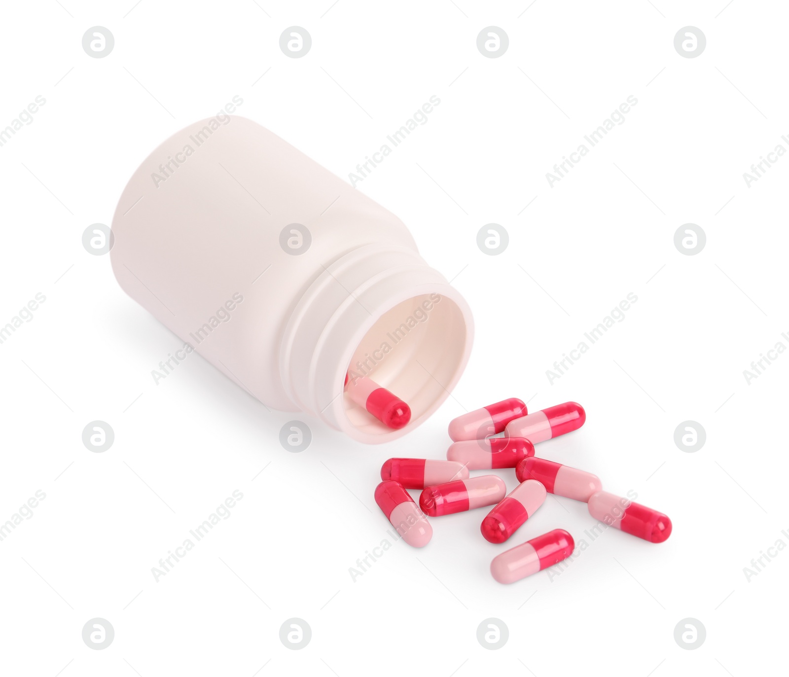 Photo of Medical bottle and pink pills on white background