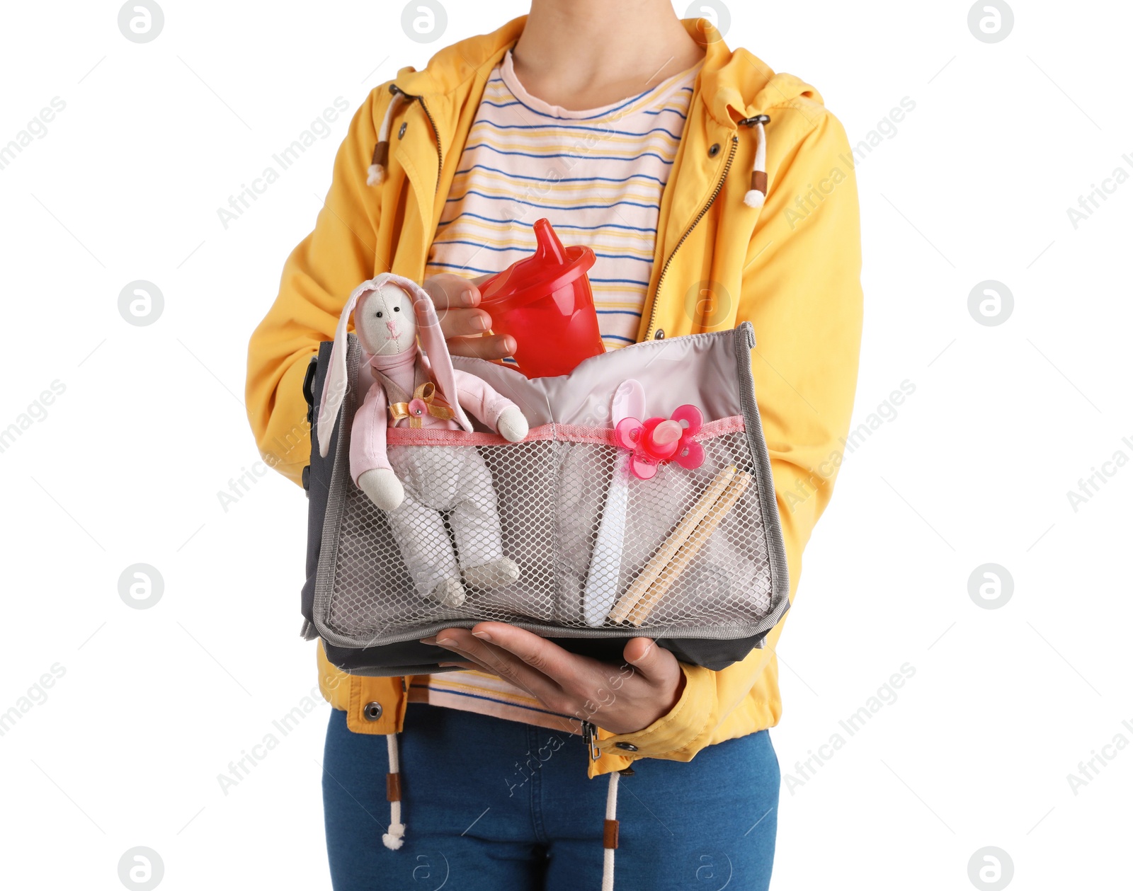 Photo of Woman holding maternity bag with baby accessories on white background, closeup