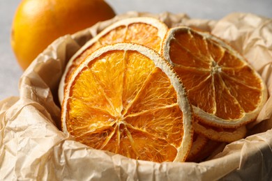 Photo of Many dry orange slices on table, closeup