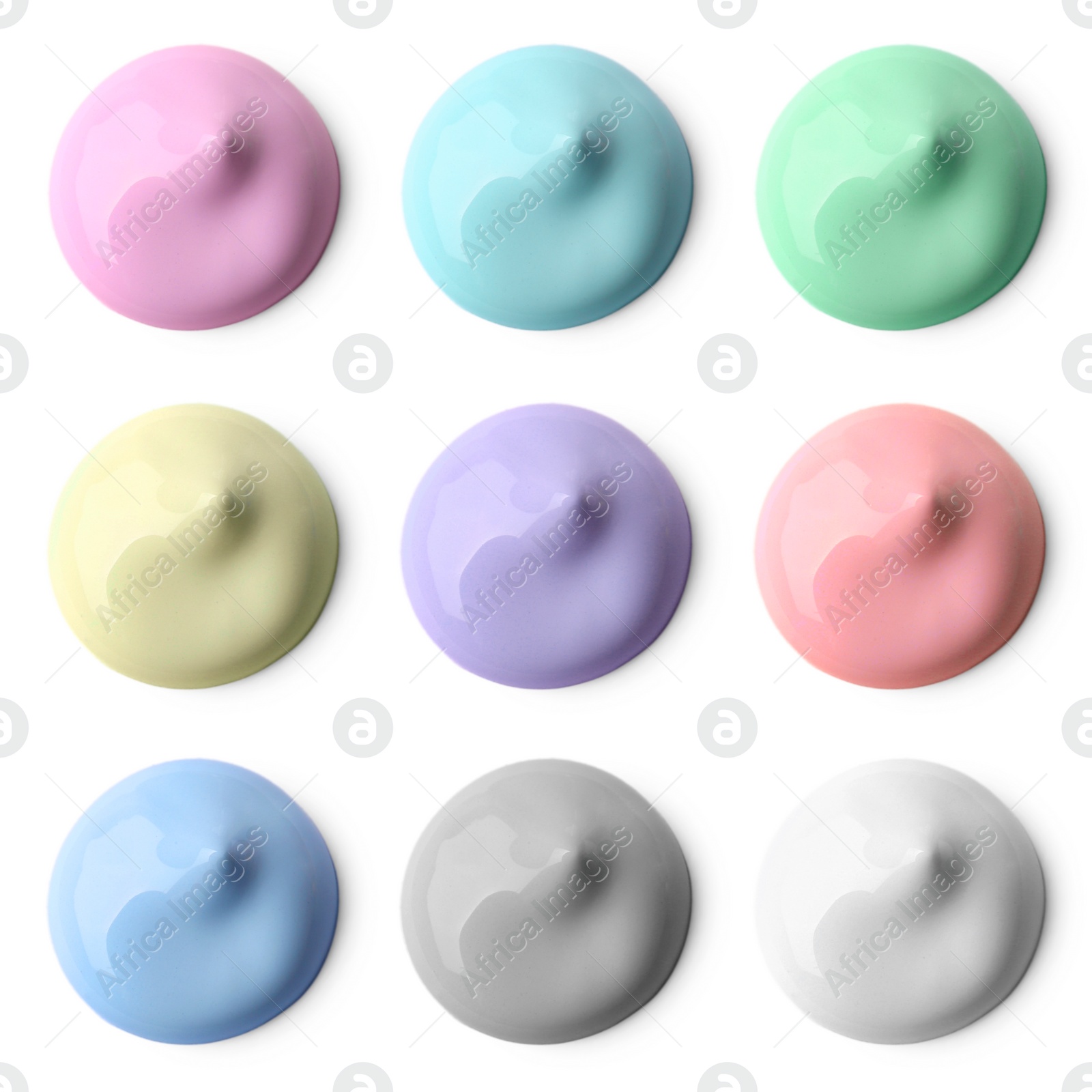 Image of Paint blobs of different colors on white background, top view