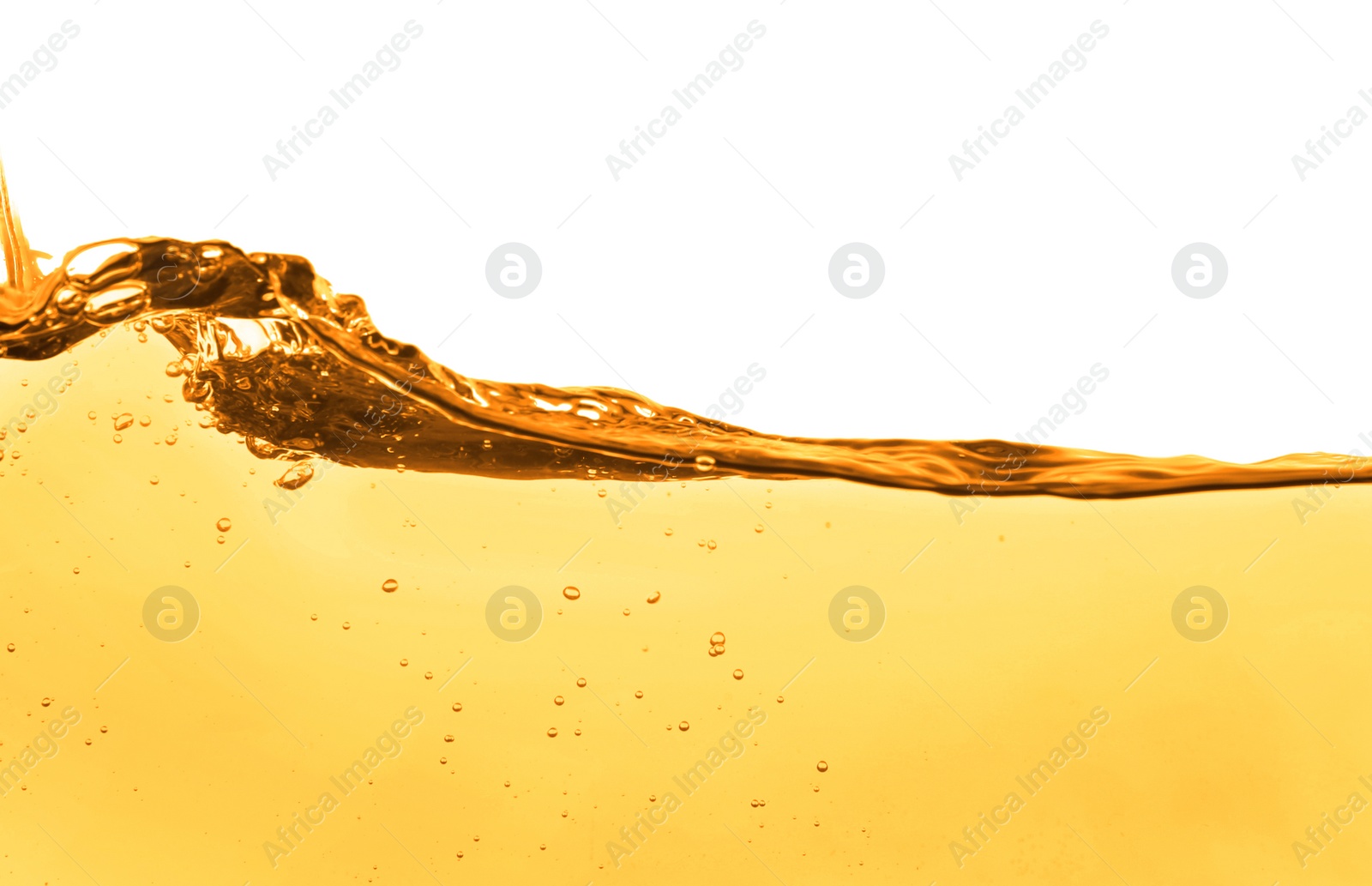 Image of Golden oily liquid splash on white background