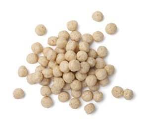 Photo of Tasty cereal balls isolated on white, top view