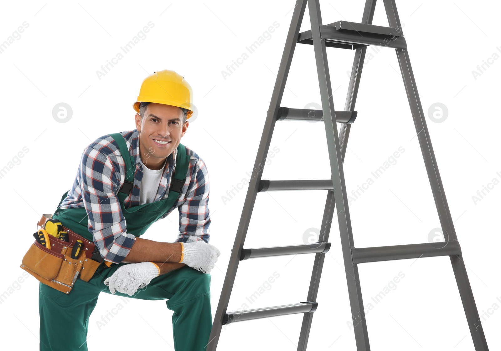 Photo of Professional builder near metal ladder on white background