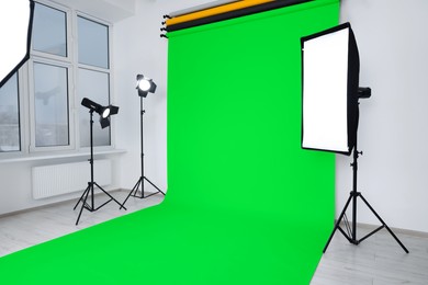 Image of Chroma key compositing. Green backdrop and equipment in studio