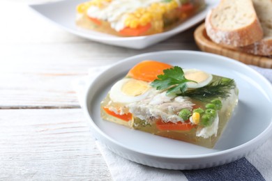 Delicious fish aspic served on white wooden table