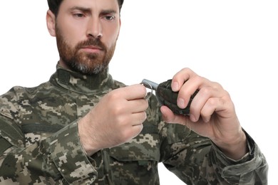 Soldier pulling safety pin out of hand grenade on white background. Military service