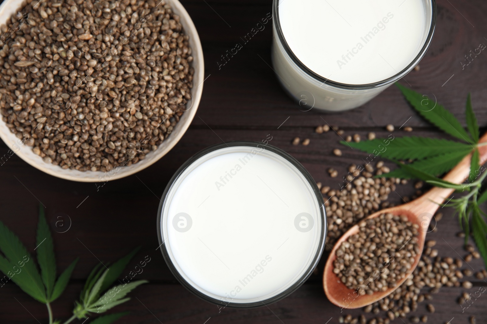 Photo of Flat lay composition with fresh hemp milk on wooden table