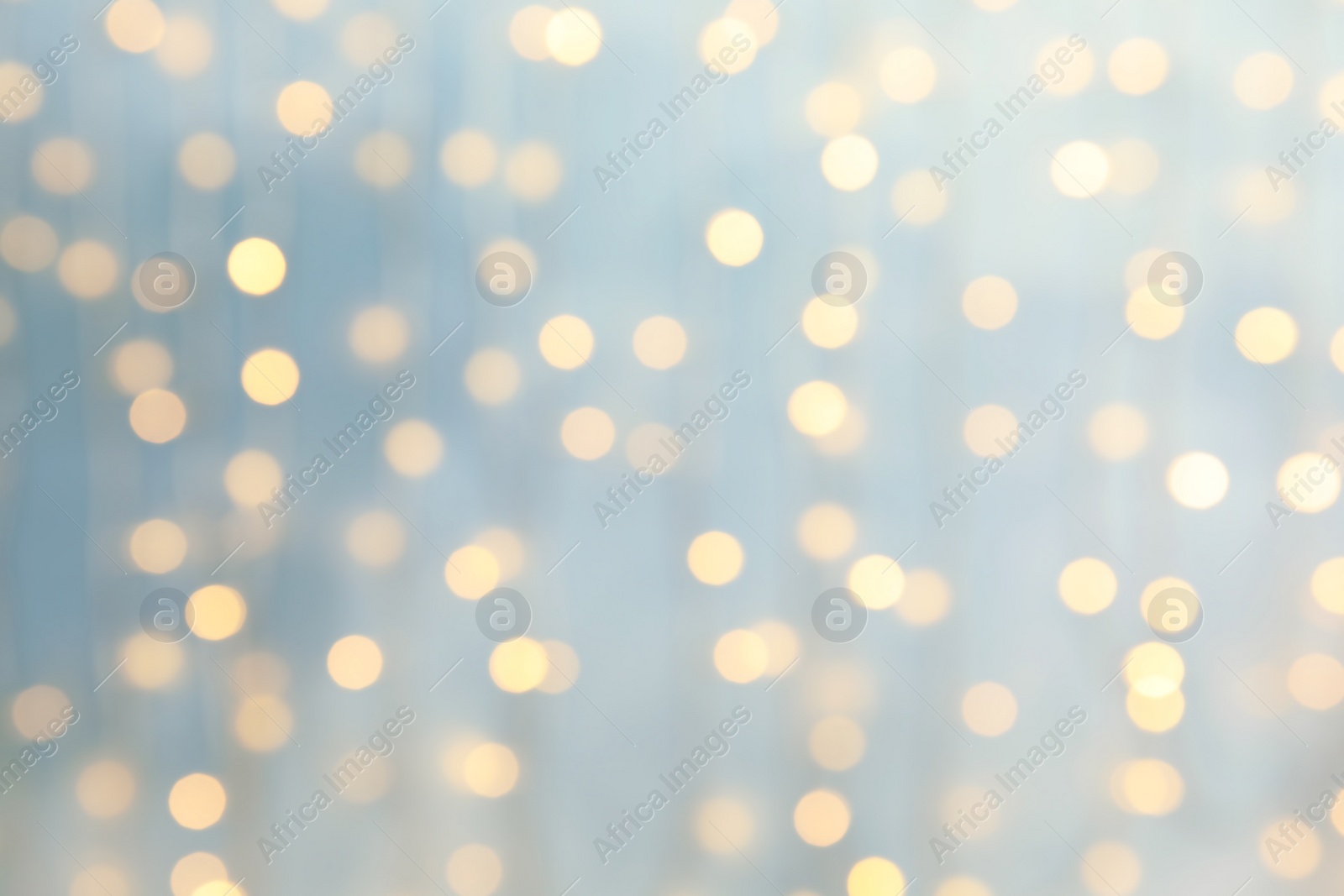 Photo of Blurred view of glowing Christmas lights as background