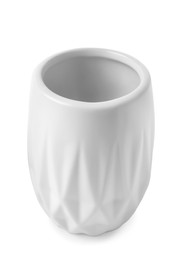 Photo of Bath accessory. Ceramic toothbrush holder isolated on white