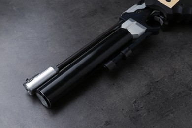 Photo of Sport pistol on black table, closeup. Professional gun
