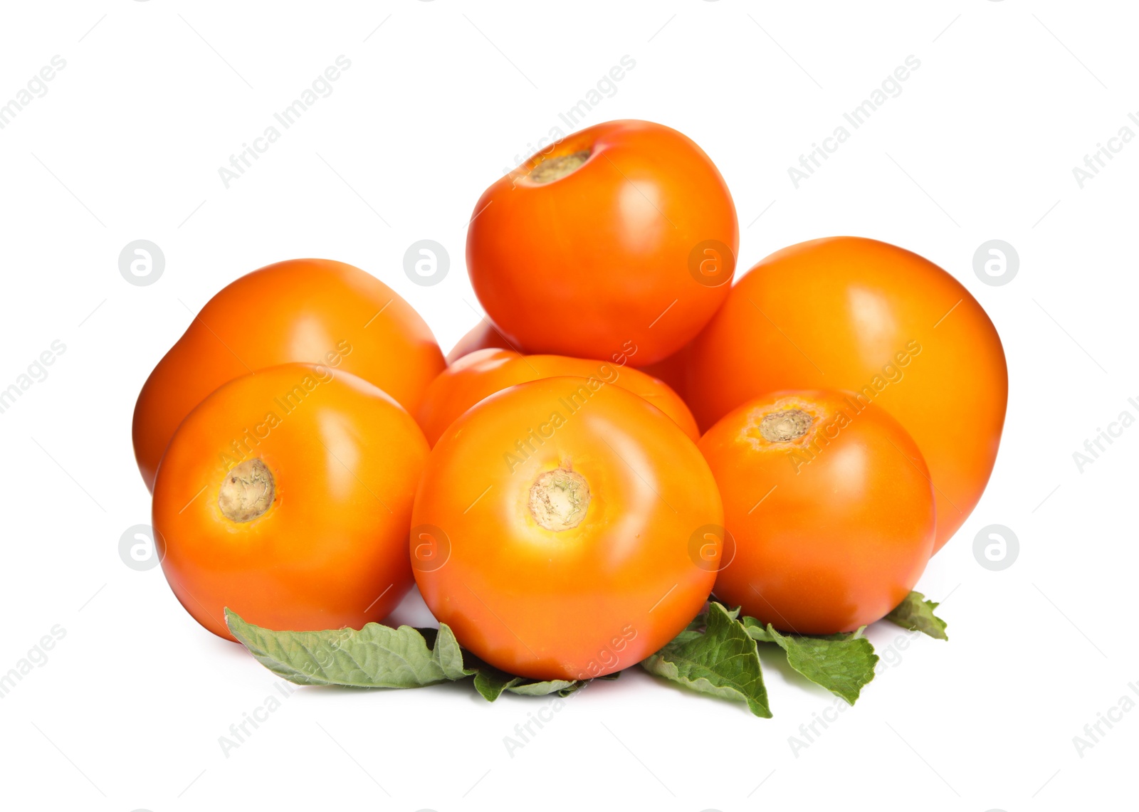 Photo of Fresh ripe yellow tomatoes with leaves on white background