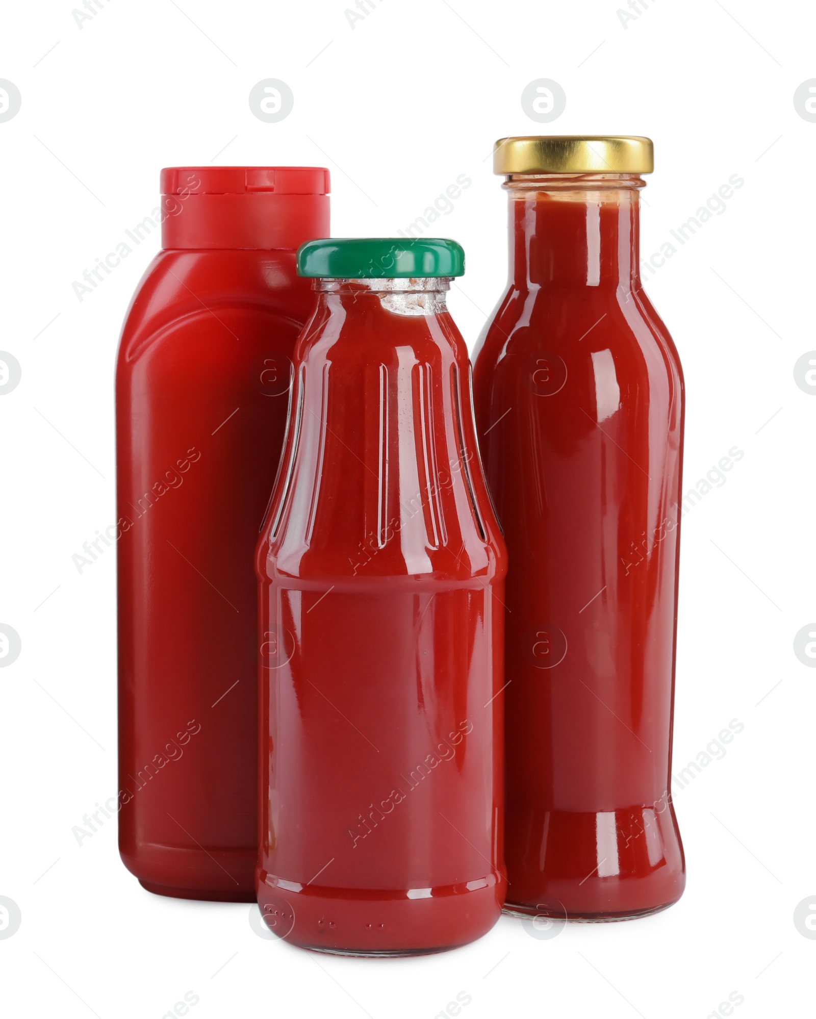 Photo of Different bottles of ketchup on white background