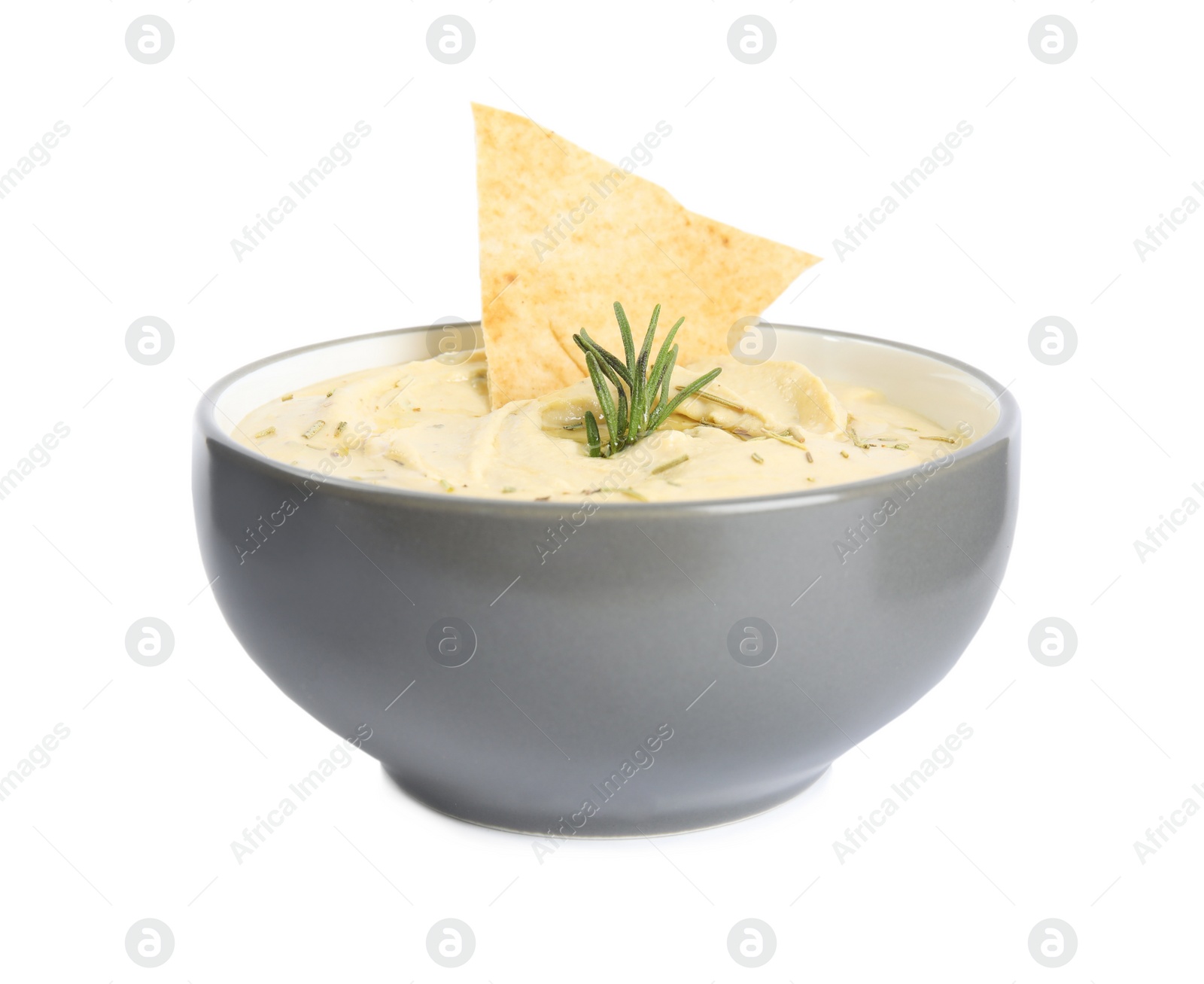 Photo of Delicious hummus with pita chip and rosemary in bowl isolated on white