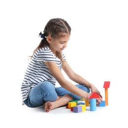 Cute child playing with colorful blocks on white background