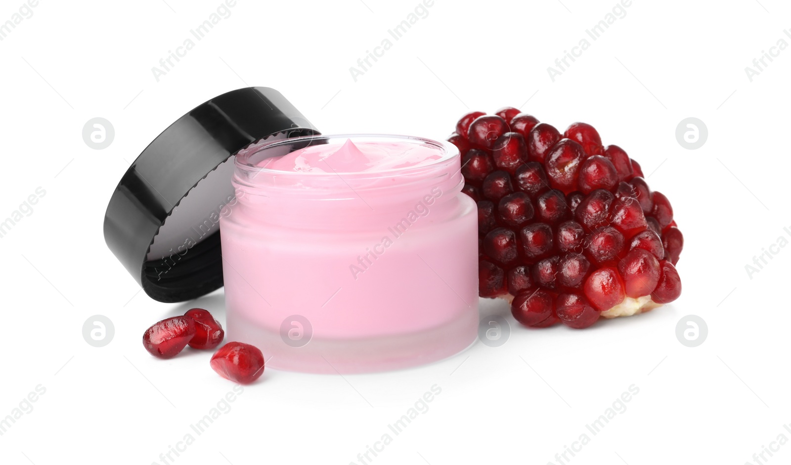 Photo of Glass jar with natural facial mask and pomegranate seeds isolated on white