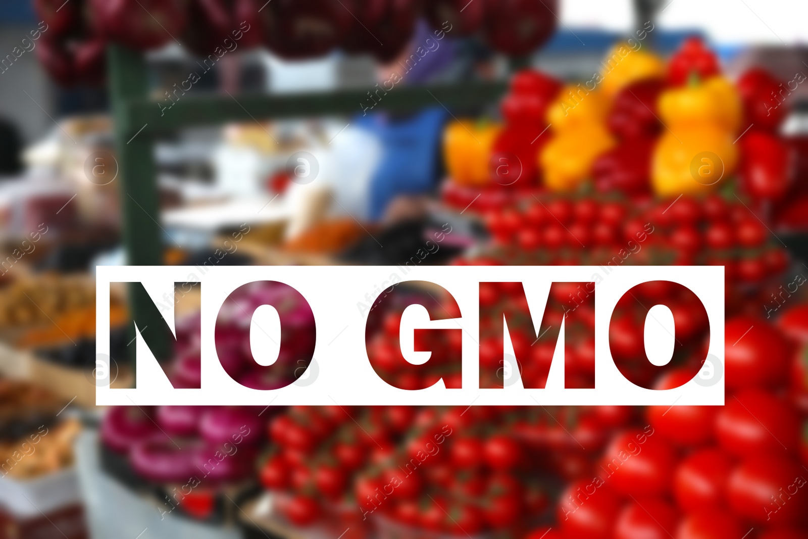 Image of GMO free products. Blurred view of ripe vegetables on counter at wholesale market