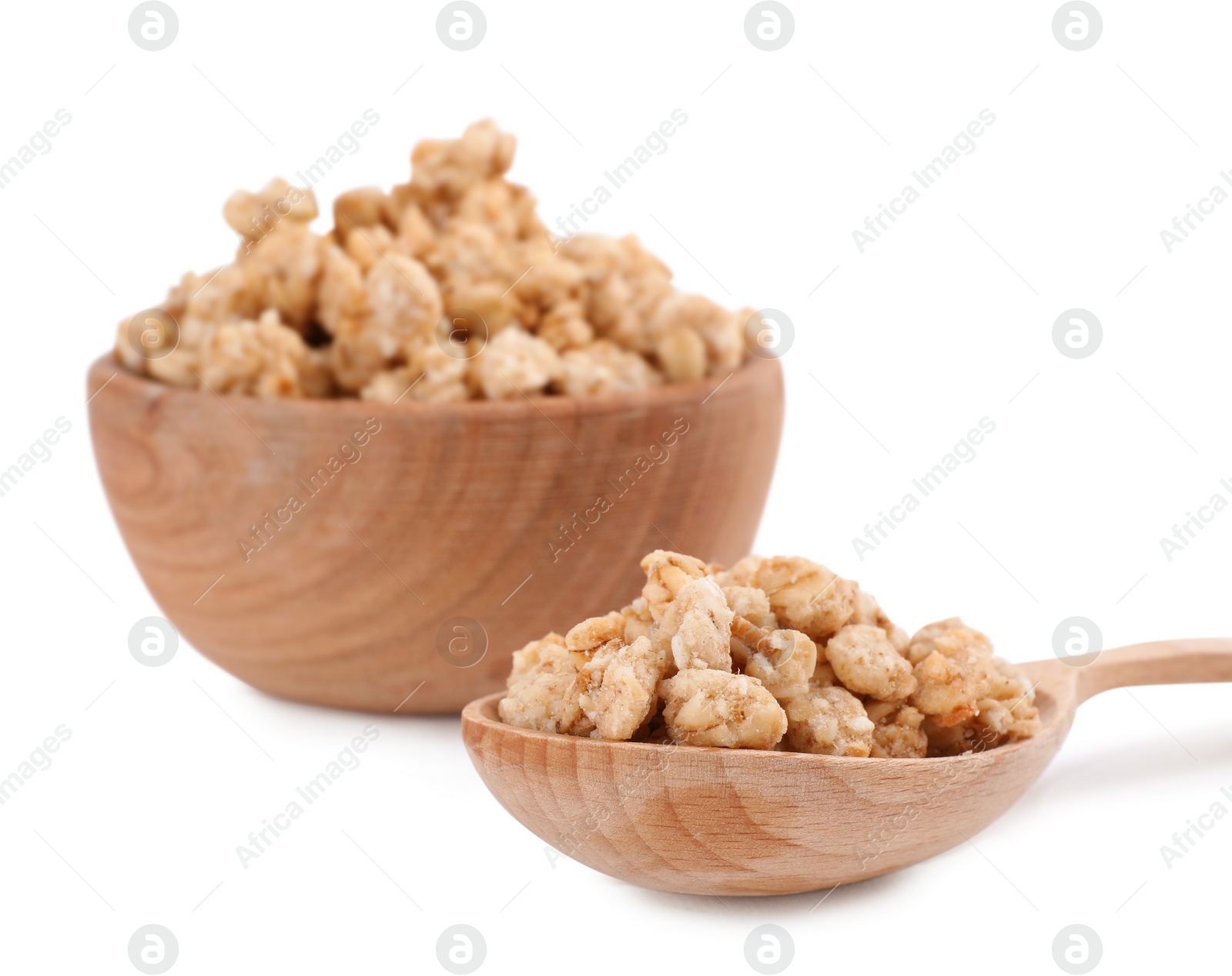 Image of Tasty crispy granola in wooden bowl and spoon on white background