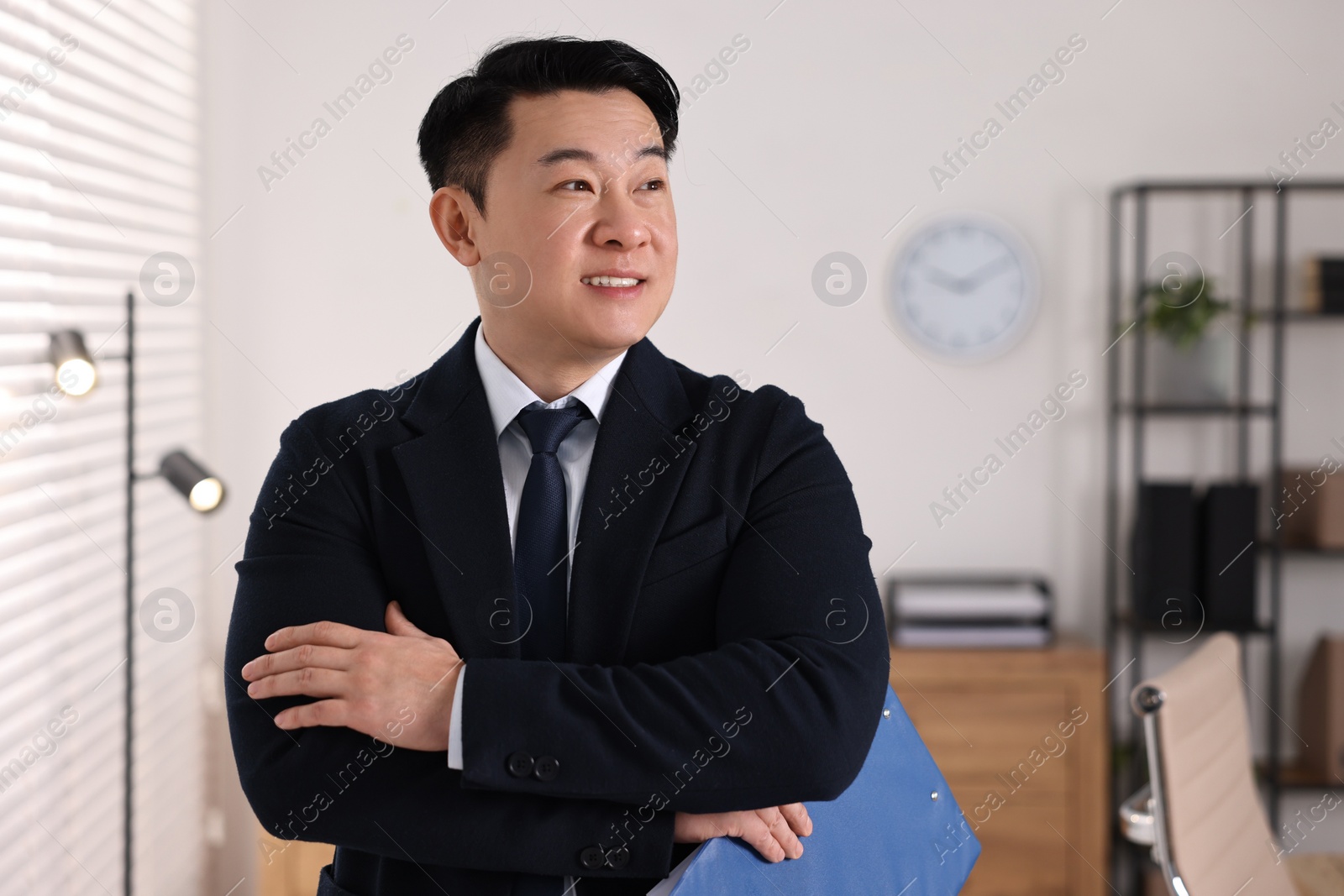 Photo of Portrait of happy notary with clipboard in office, space for text