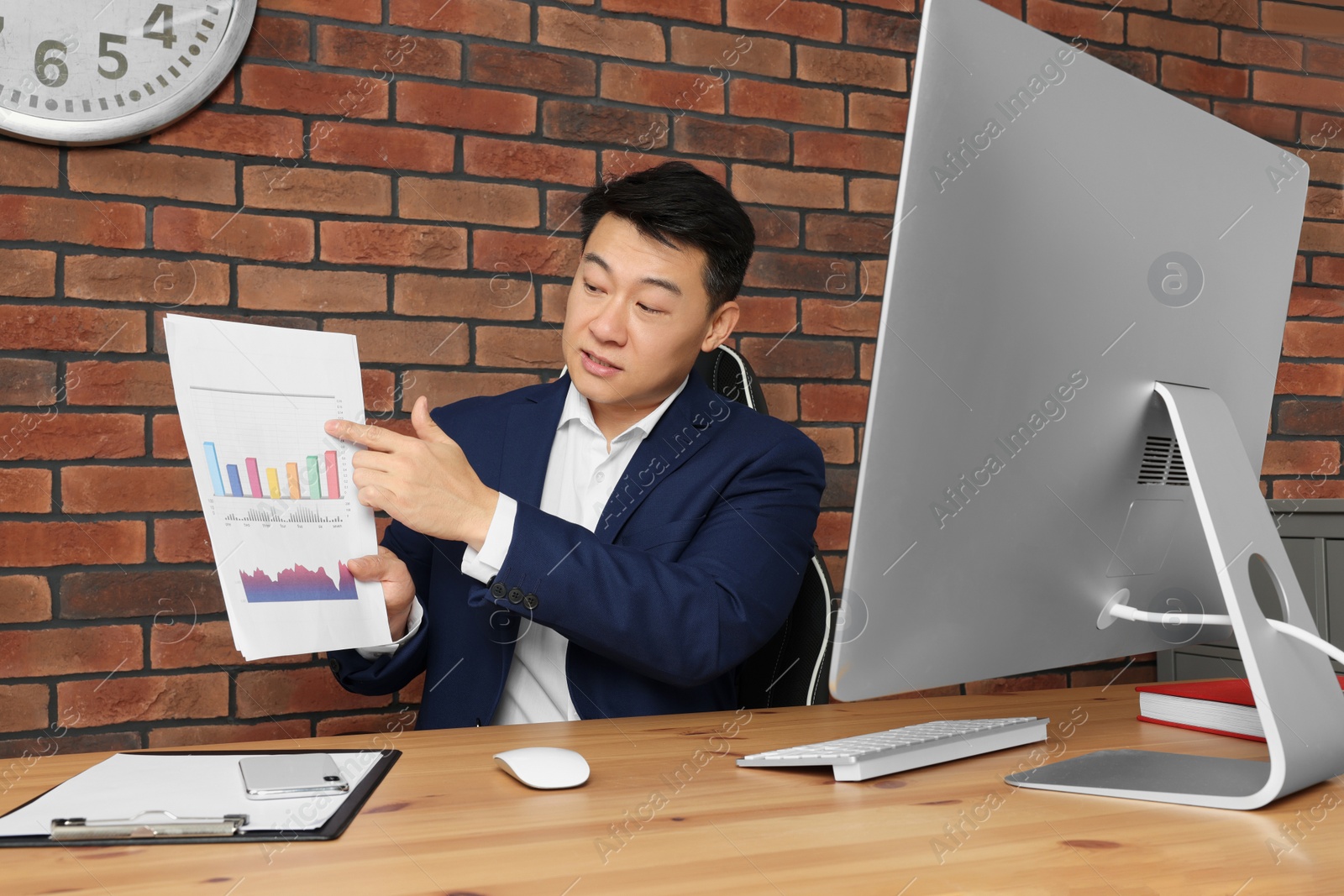 Photo of Boss having online meeting at wooden table in modern office