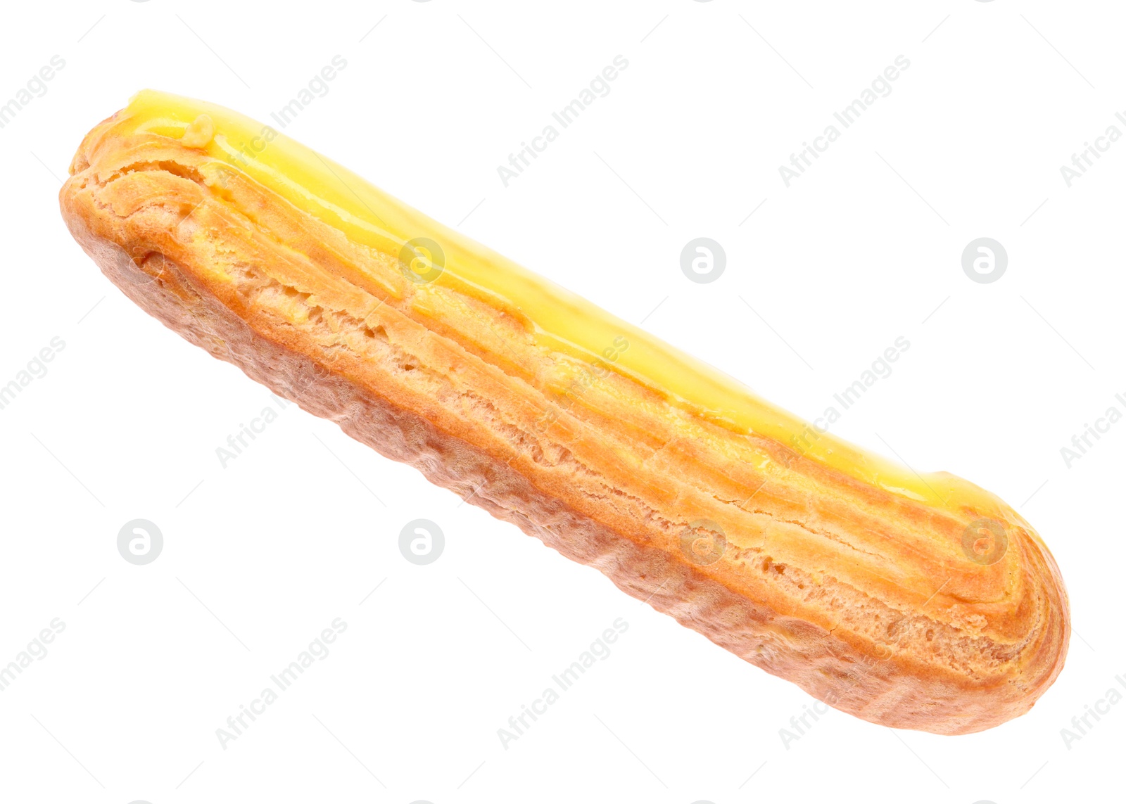 Photo of Delicious eclair covered with yellow glaze isolated on white