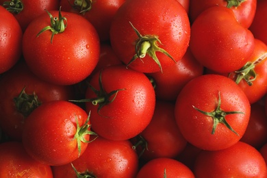 Fresh ripe red tomatoes as background, closeup