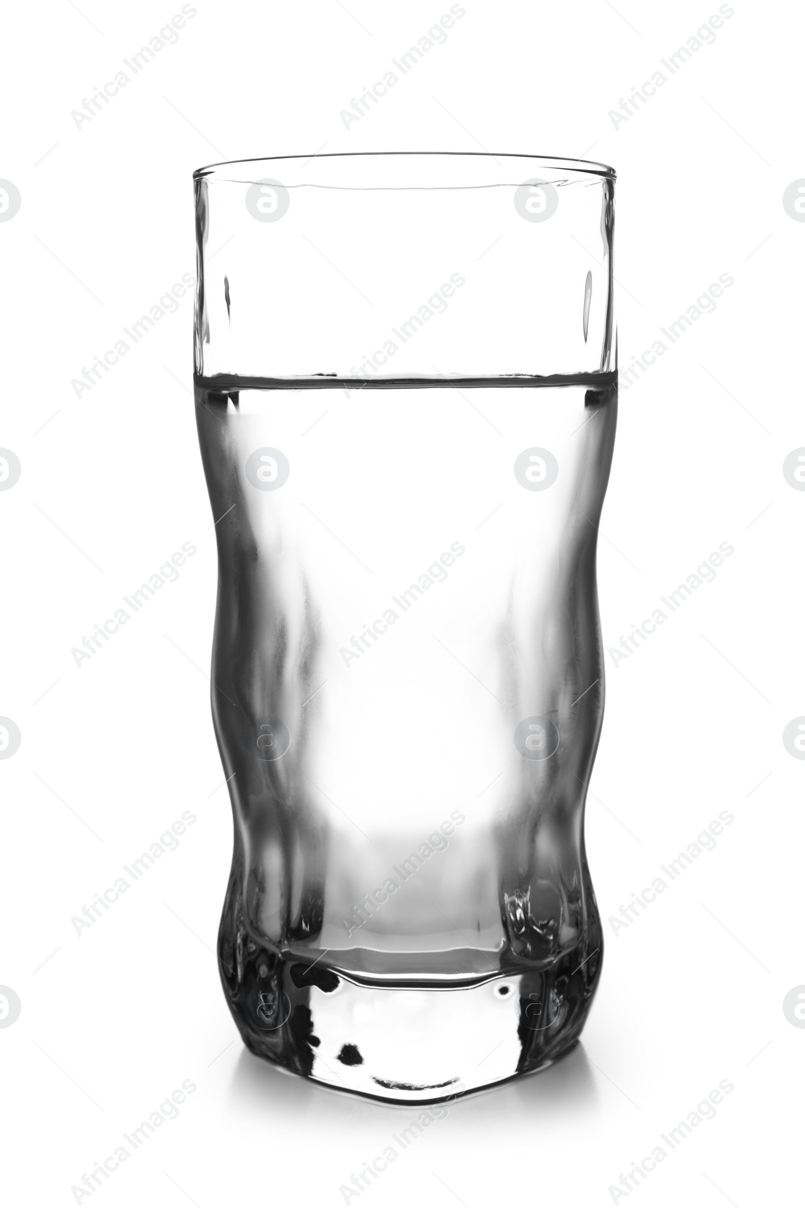 Photo of Glass of cold clear water on white background. Refreshing drink